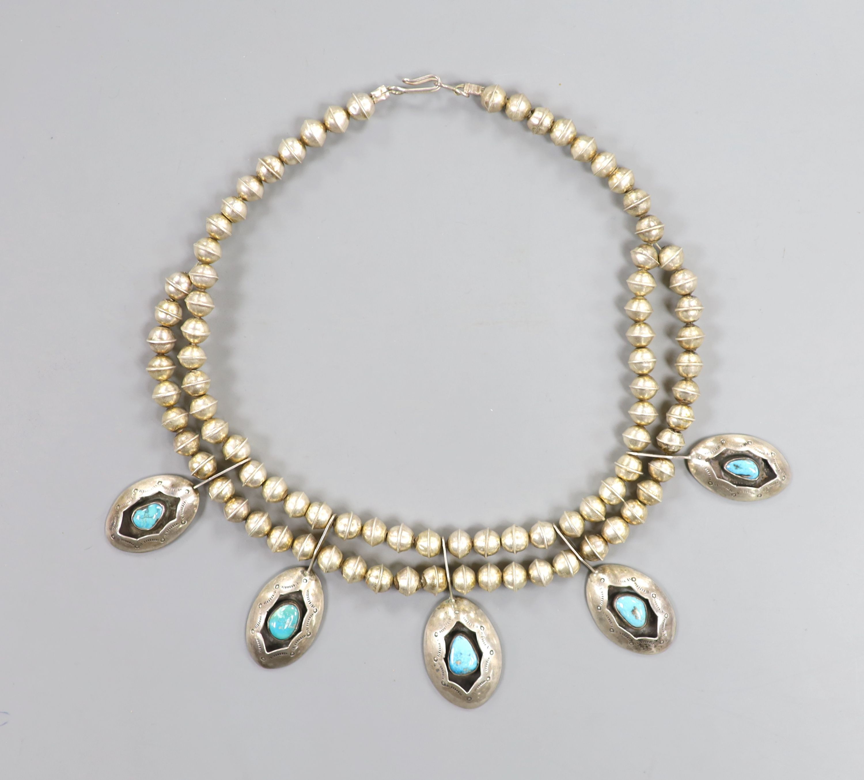 A 20th century South American? white metal and turquoise set drop necklace, approx. 44cm, gross weight 52 grams.